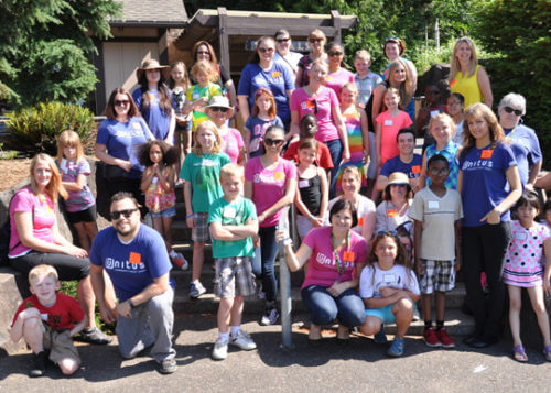 Credit Union Partners: Unitus volunteers with local school children.
