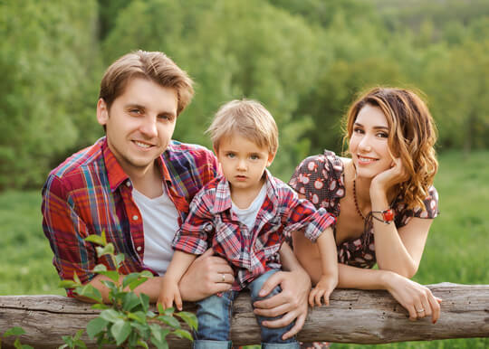 young family of 3 posing for portrait