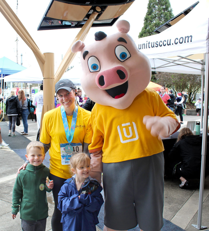 Hamilton with Unitus employee and two kids
