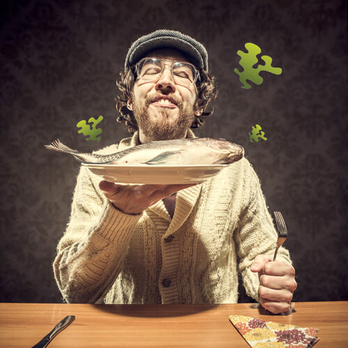 Man with plate of fish