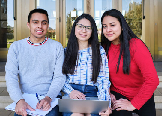 three college students studying