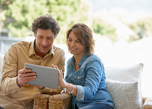 couple planning retirement on tablet
