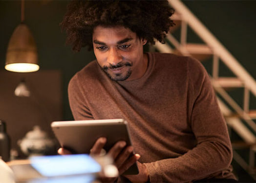 man browsing web on tablet