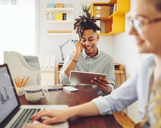 Business partners working together from their home office.