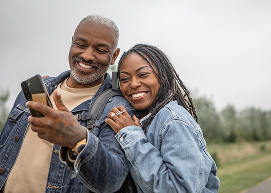 Mid-age retired couple taking selfie